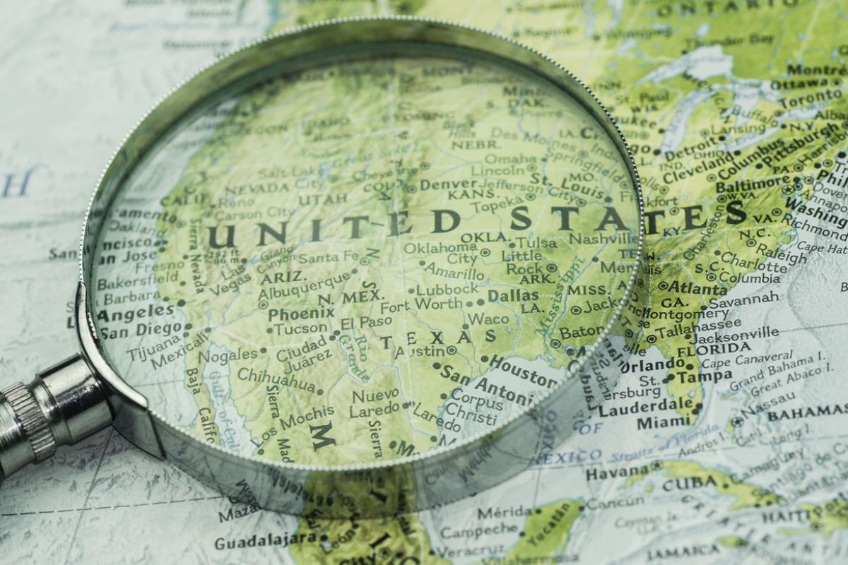 Magnifying glass on a map of the U.S.
