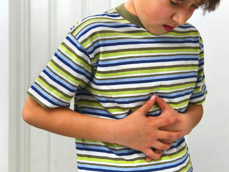 Child with hands on midsection