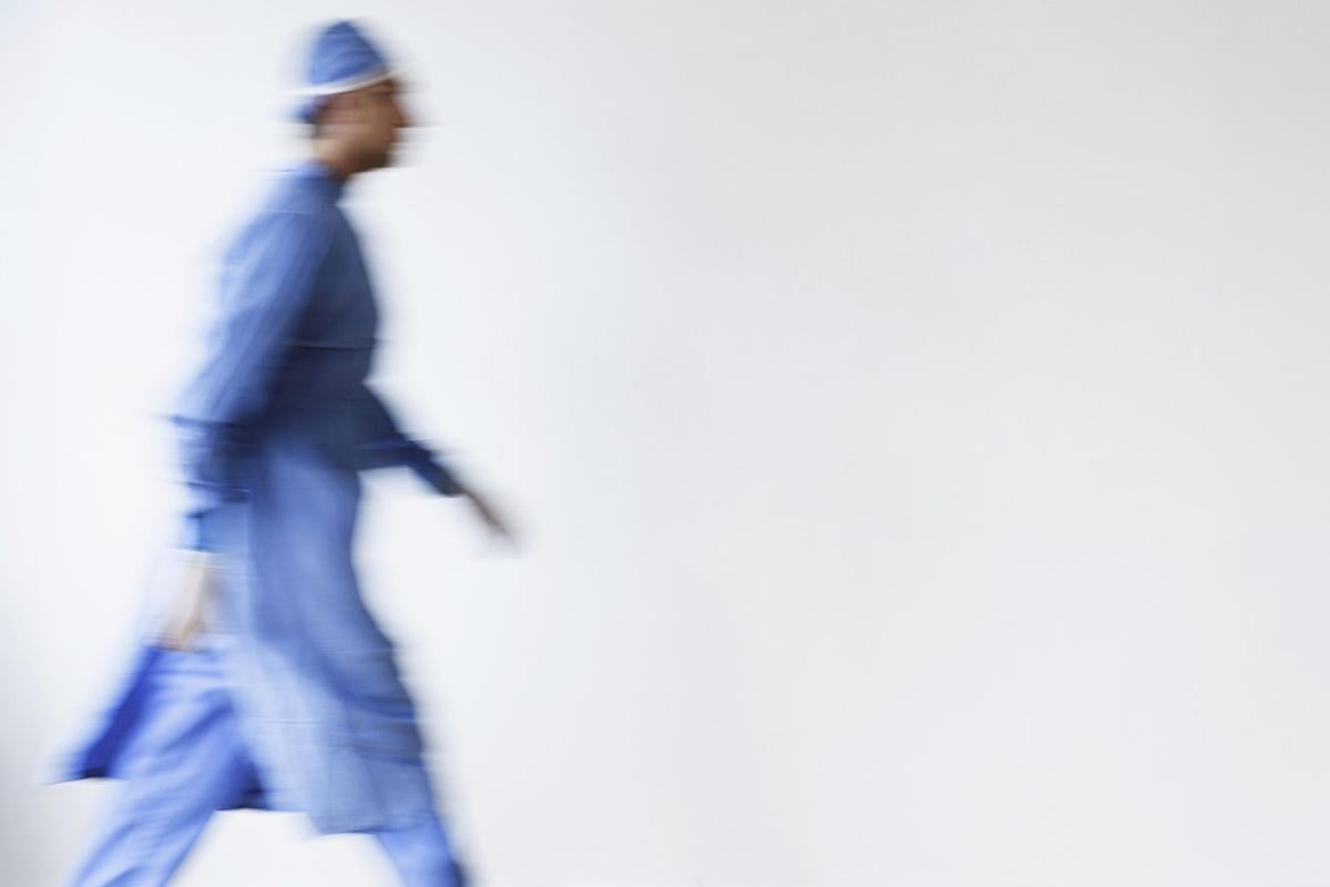 Blurred view of surgeon walking