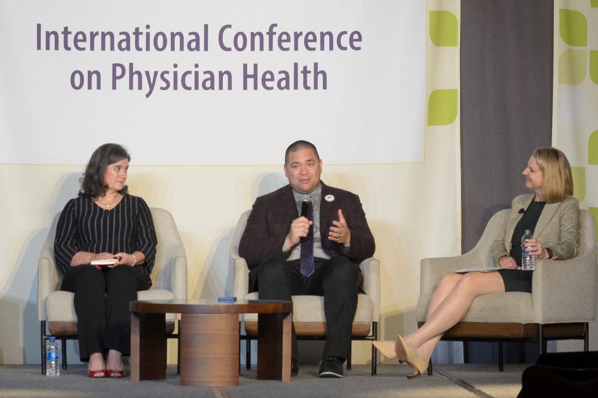 Three panelists at a health conference