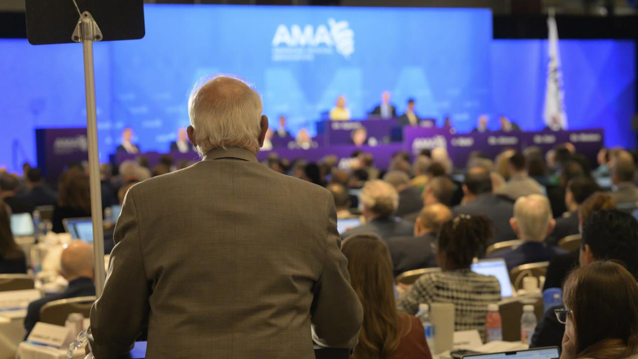 Delegate at the podium at the 2025 Annual Meeting of the HOD