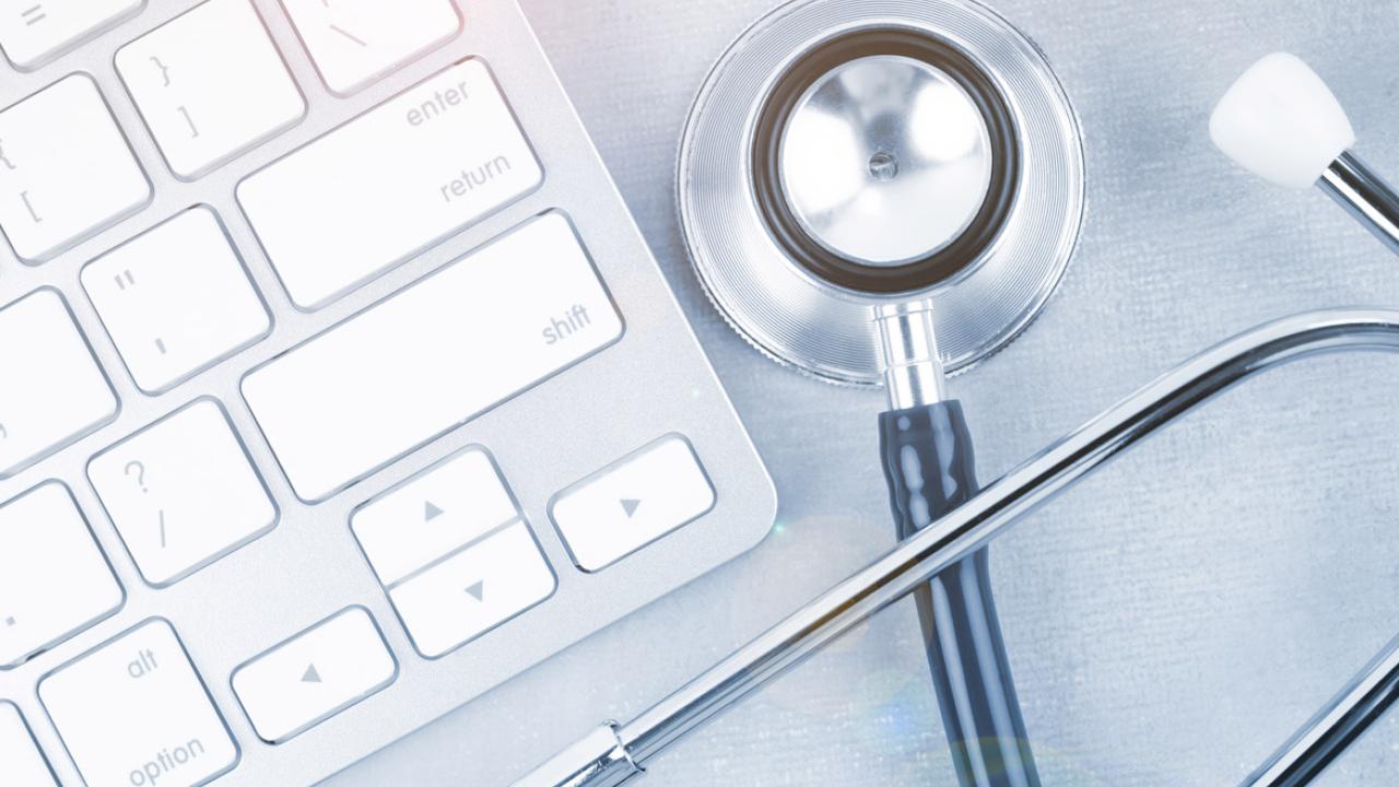 Stethoscope next to keyboard