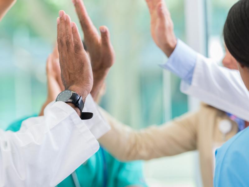 Medical professionals give high fives