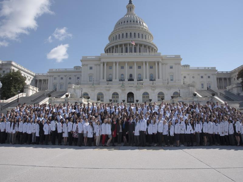 A photo of a large group of physicians at the Capitol Building in Washington, D.C.