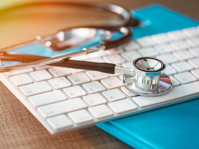 Stethoscope on computer keyboard