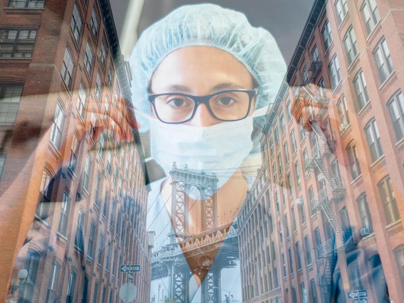 Health care worker superimposed over city buildings