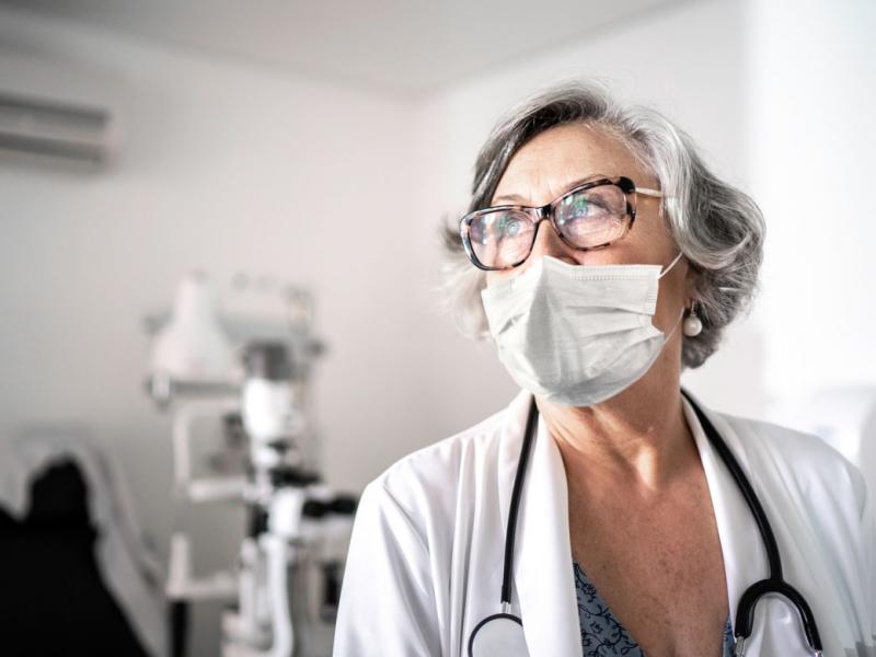 Woman physician wearing a face mask