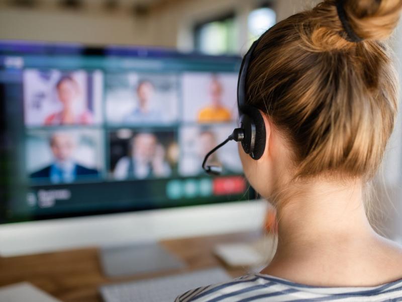 Person at a computer having a virtual meeting