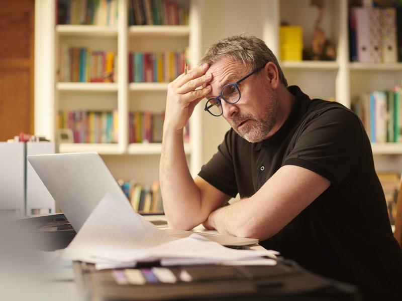 Person working in front of a laptop