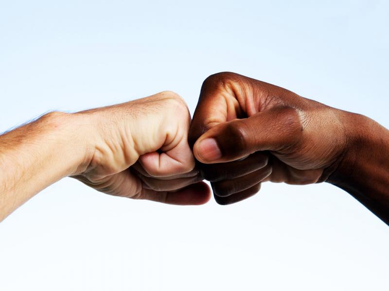 Two hands giving each other a greeting