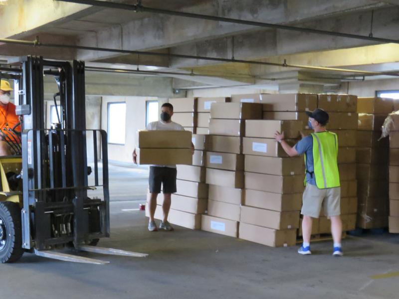 Forklift being used for boxes of N95 masks to be distributed by Texas Medical Association.