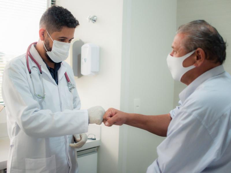 Patient and physician fist bump