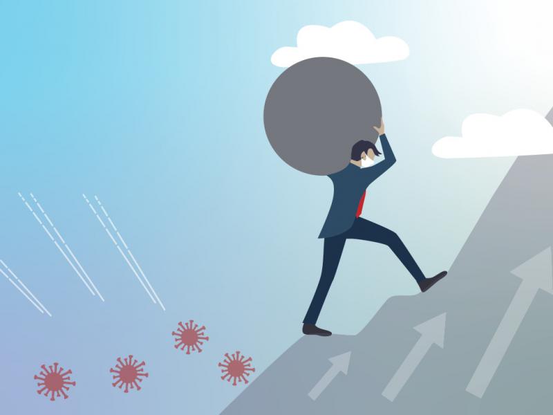 Figure walking boulder up a hill