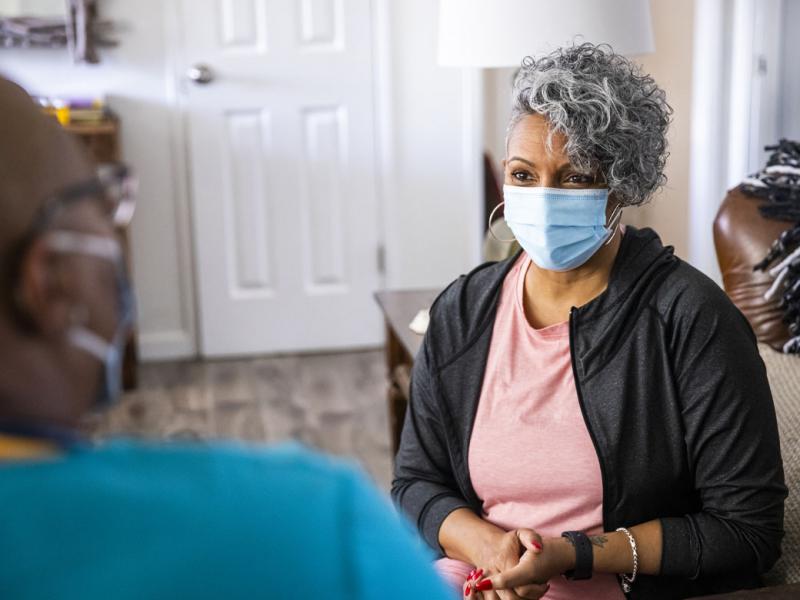 Patient speaking with a health care worker