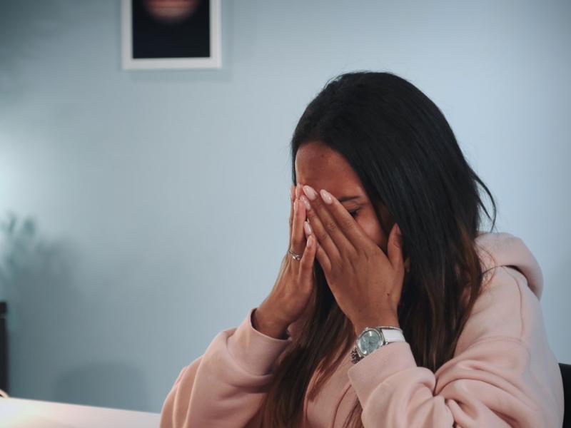 Person with hands on head