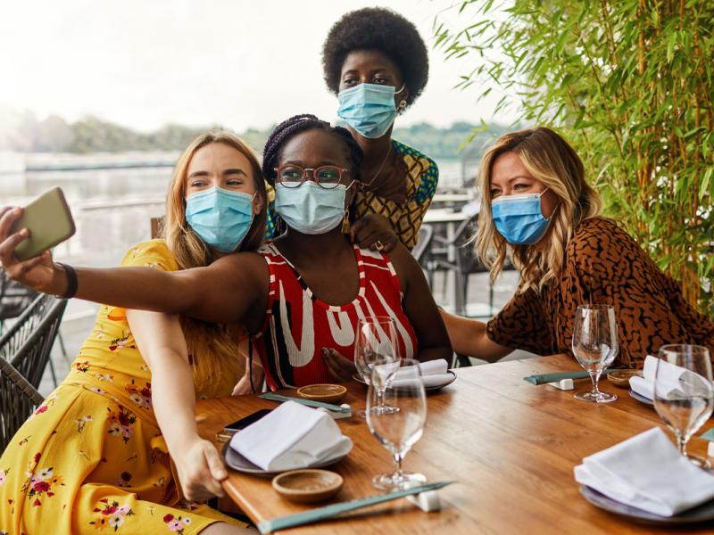 Group of people taking a photo with a smartphone