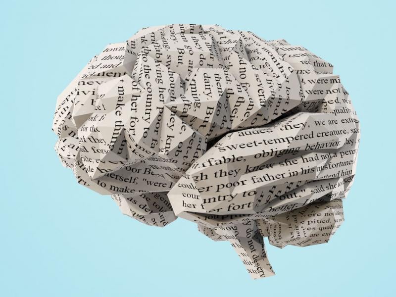 Photo illustration of a human brain made from crumpled up paper.