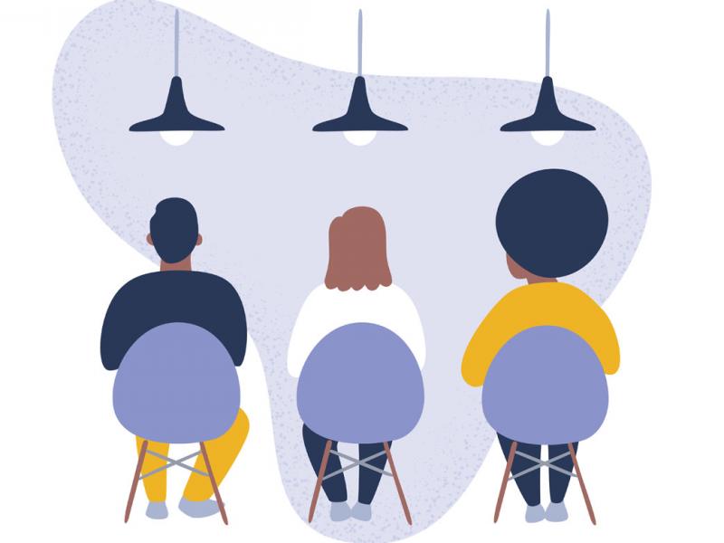 Three people sitting in chairs