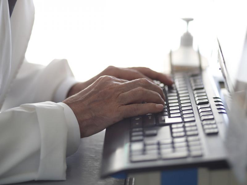 Hands typing on a keyboard