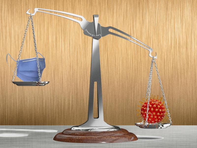 Scale balancing a face mask and coronavirus