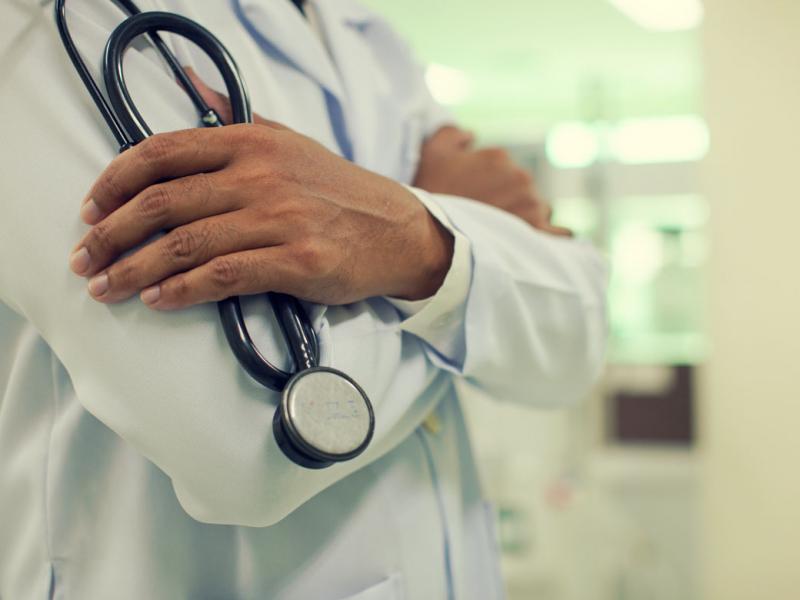 Physician with arms crossed