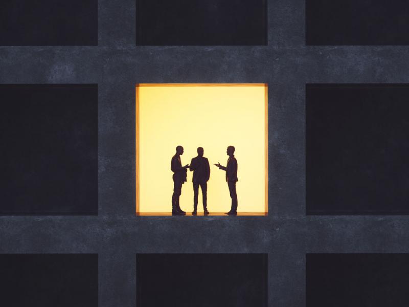 Silhouettes of three figures