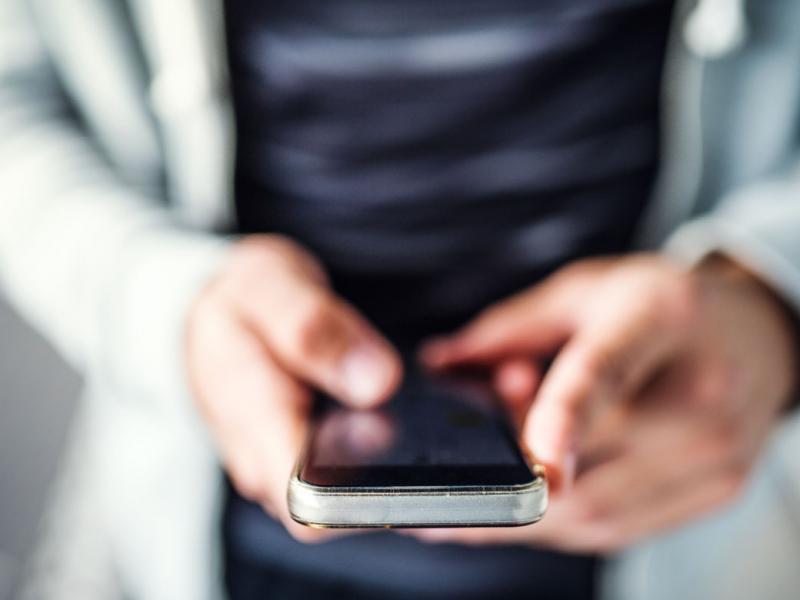 Hands holding a smartphone