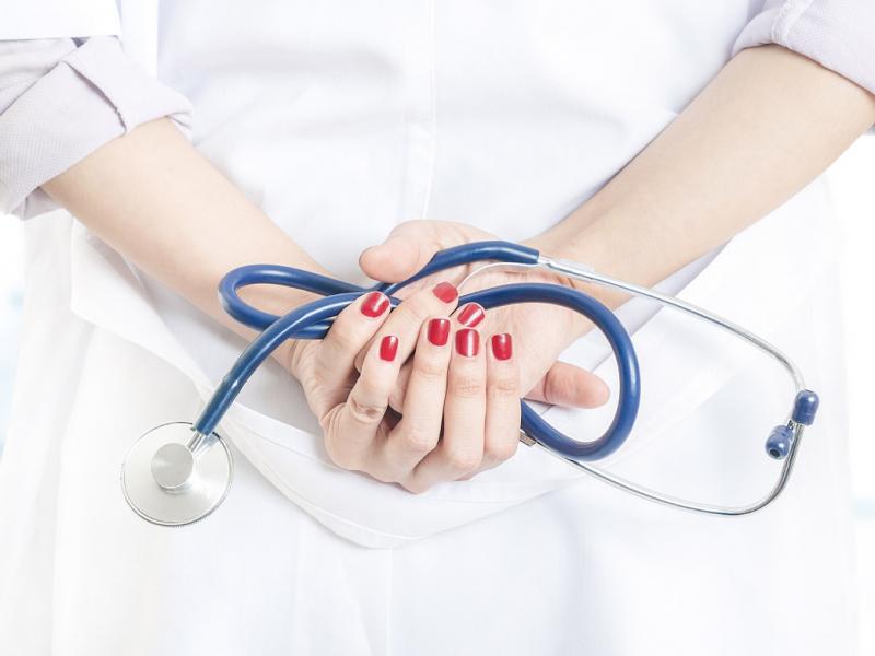 Physician holding a stethoscope