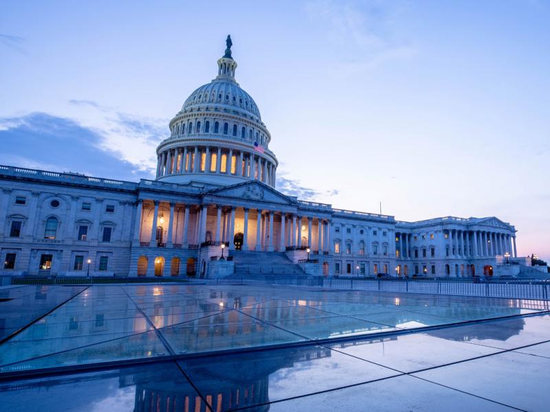 Wide shot of Capitol building and plaza at dawn