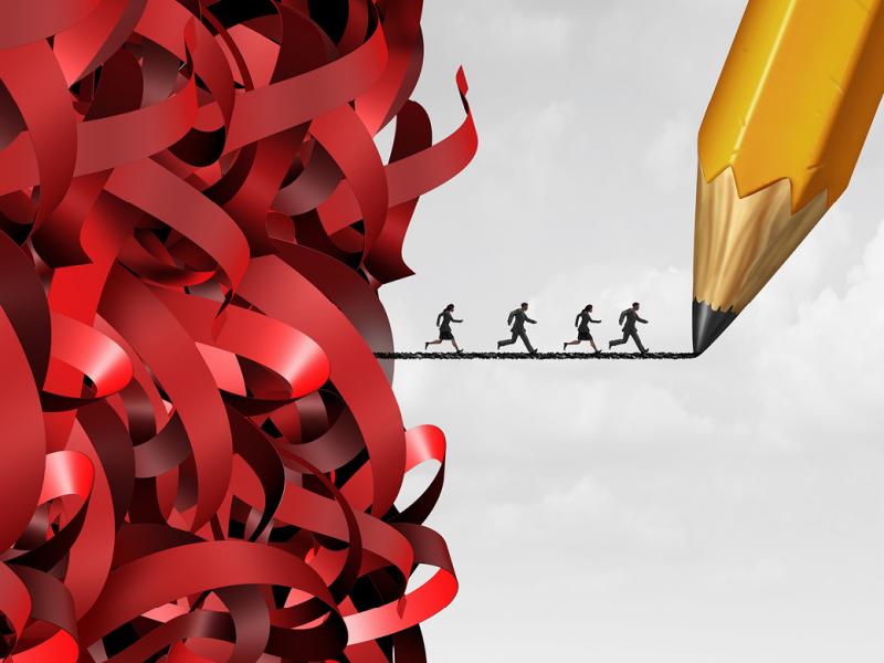 A group of people running across a graphite powder line placed between a cascade of ribbons and a pencil tip