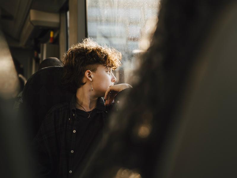 Person looking out a window