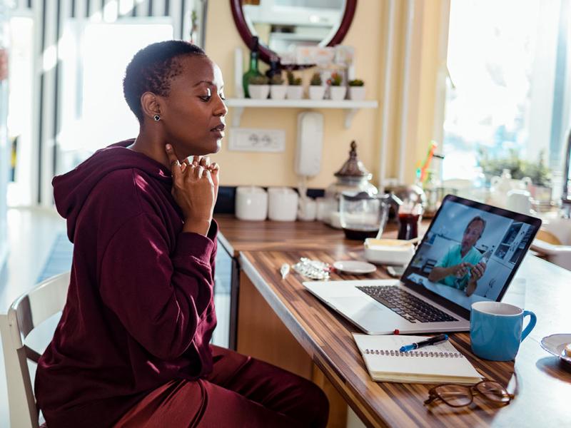 Patient and physician in a telehealth appointment