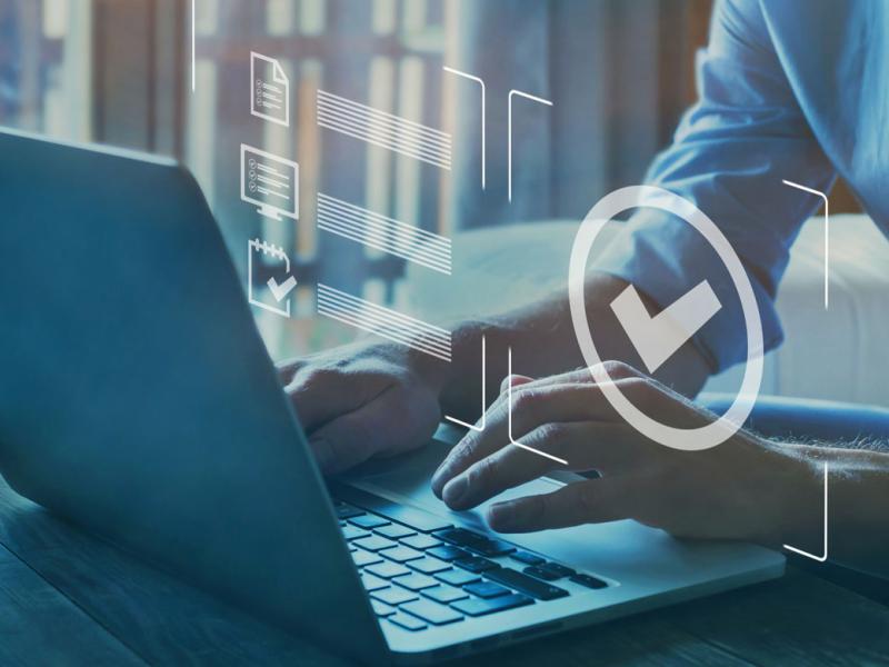 Hands on a laptop with inbox icons