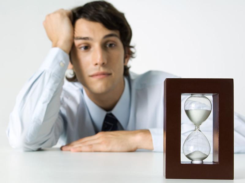 Person looking at hourglass