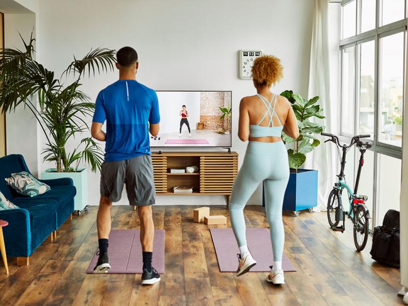 Two people working out at home