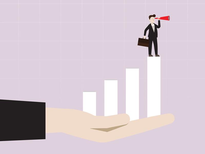 Businessperson with telescope standing on top of the bar graph in a helping hand