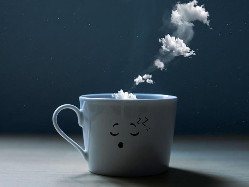 Smoke and white clouds come out of a mug