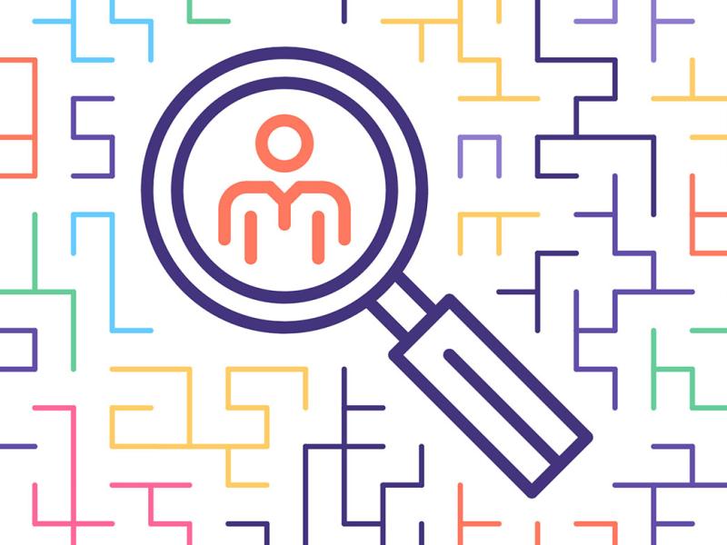 Magnifying lens on a human figure centered in a maze