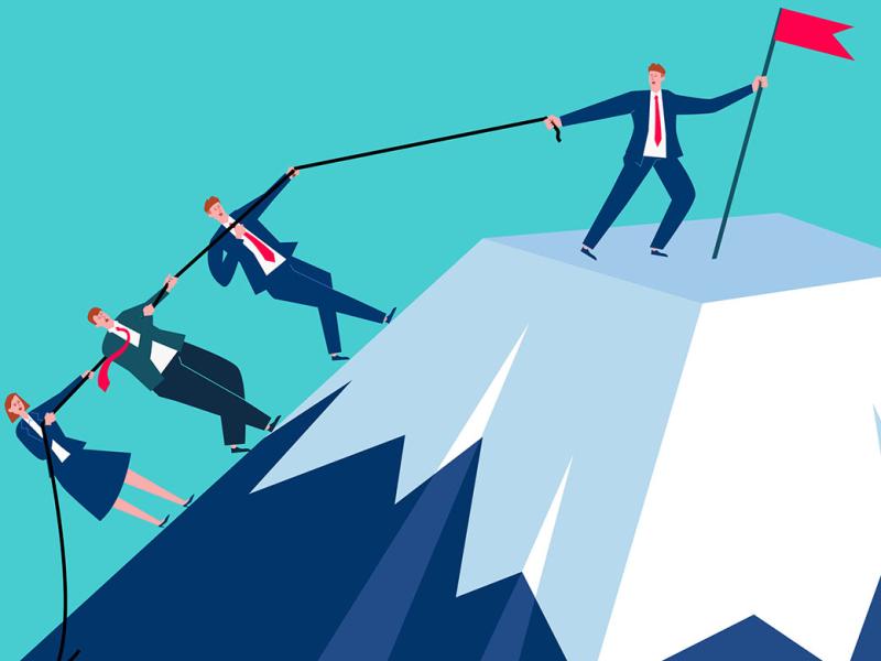 Figure holding up a flag at the top of the mountain while others follow