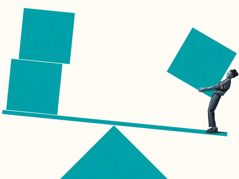 Person holding a block on a scale