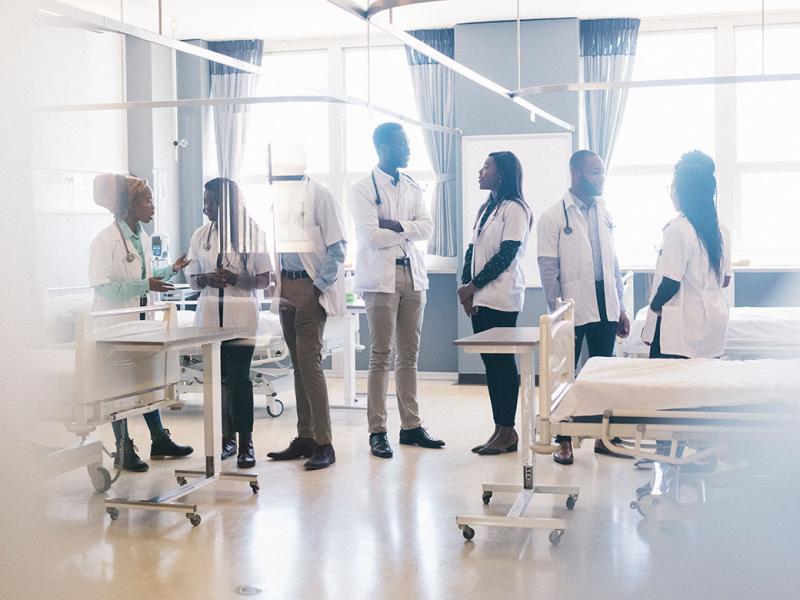 Group of medical students speaking in a hospital