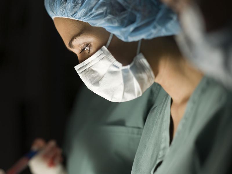 Profile of a health care worker in an operating room