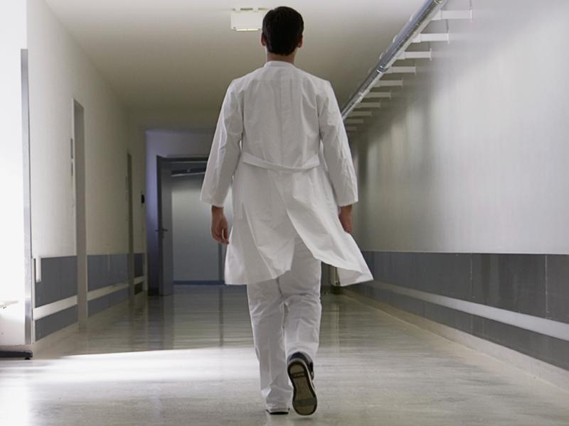 Doctor walking down corridor