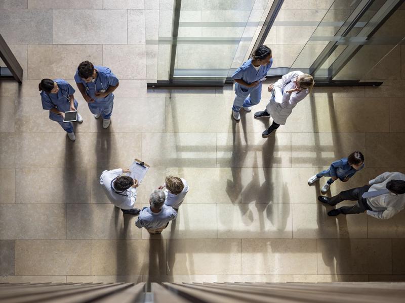 Overhead shot of health professionals in lobby of hospital or health center