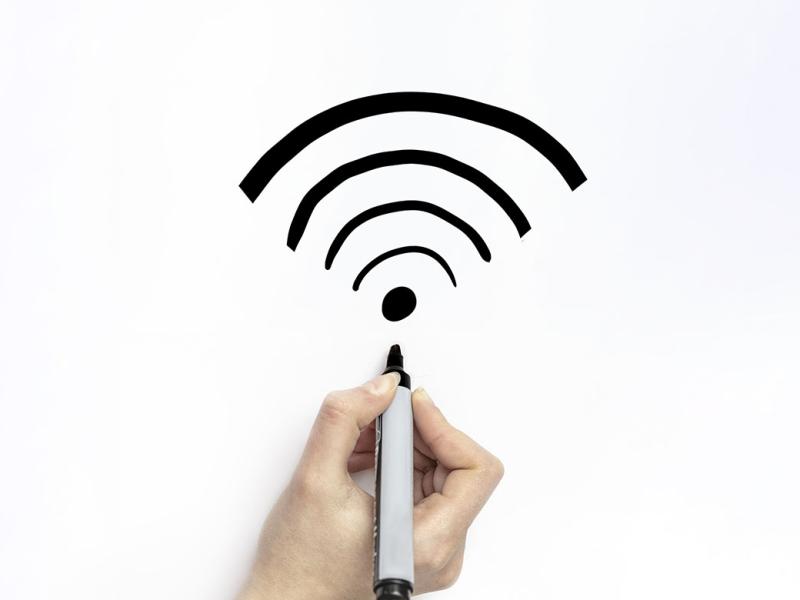 Hand drawing a wifi symbol