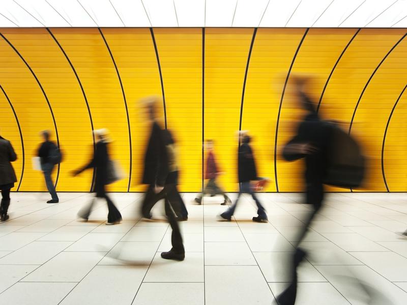 Blurred image of commuters in a tunnel