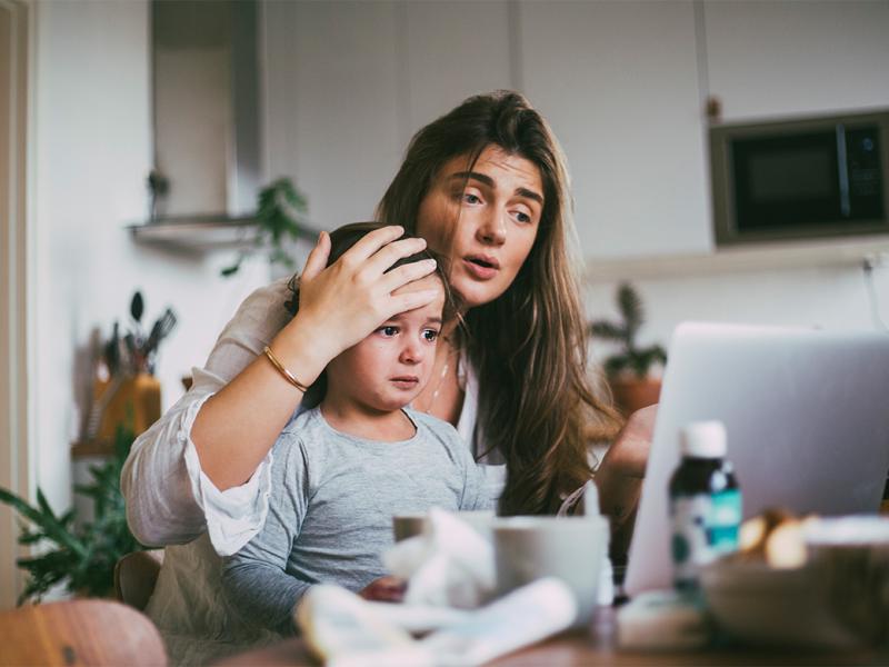 Parent and child in a telehealth appointment