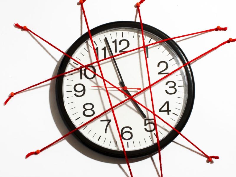 Clock covered in red tape