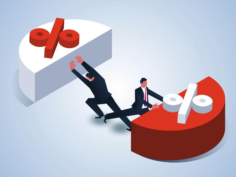  Two businessmen pushing away an average sized pie chart