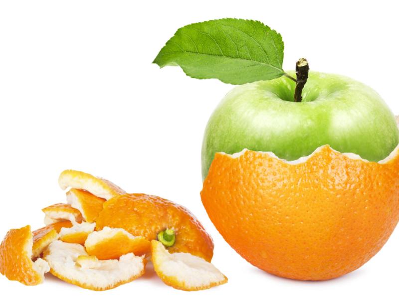 Peeled orange reveals an apple